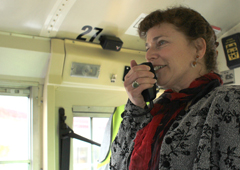 LisaSpeakingOnBus-240px