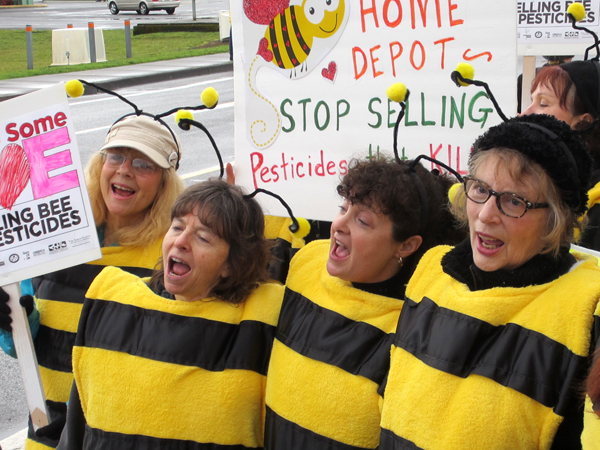 The bee people sang, "All we are saying is give bees a chance."