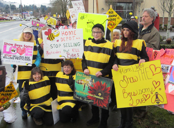 Several bee-costumed ralliers posed for the news camera.