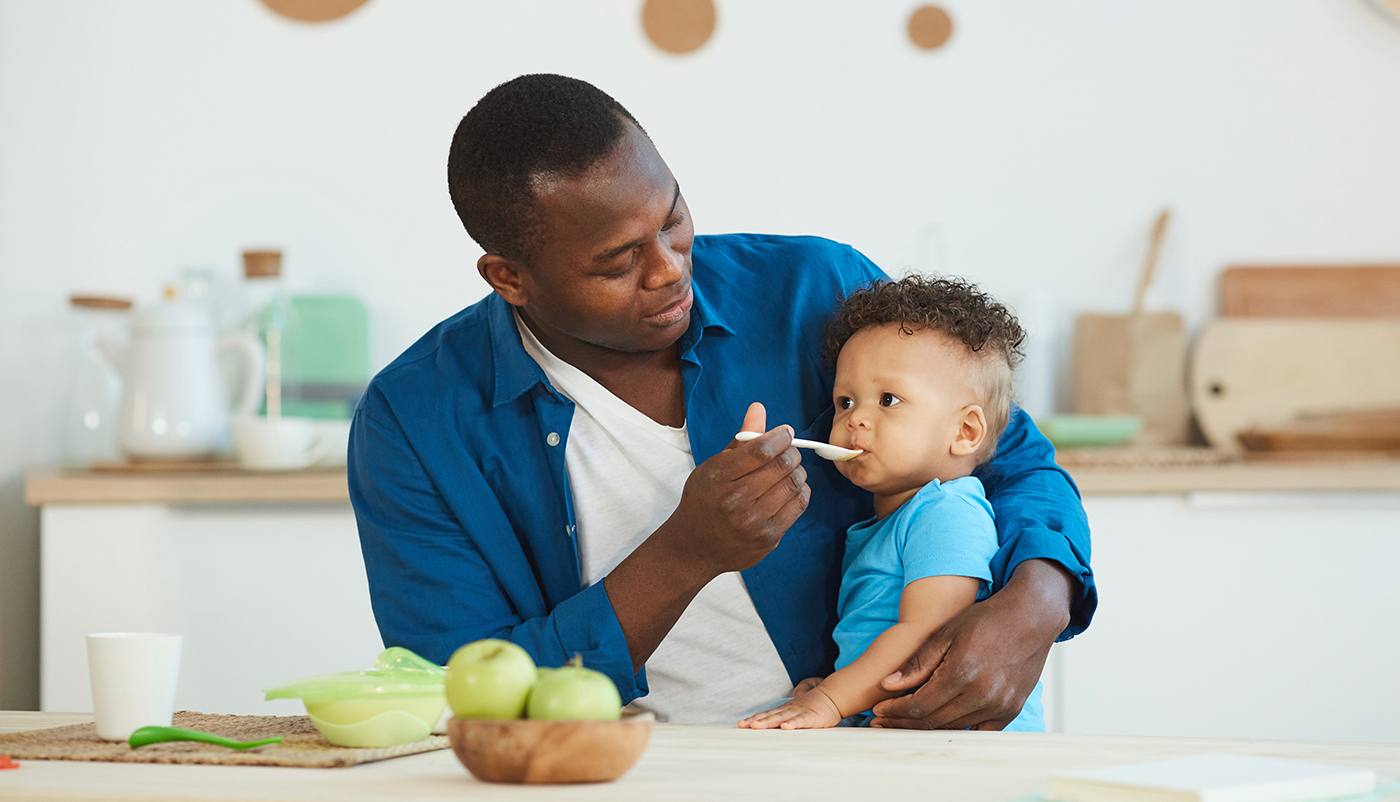 Man Feeding Son