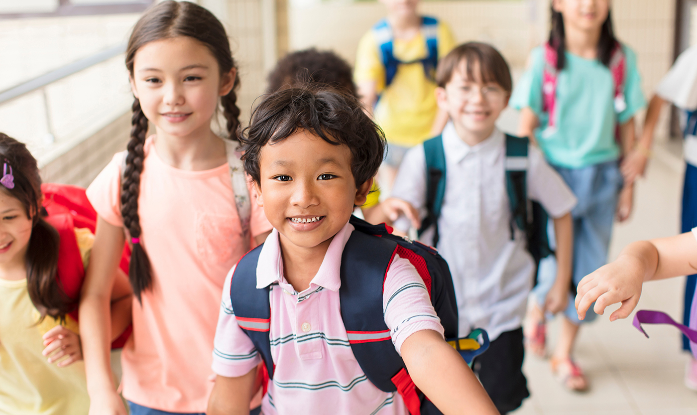 happy Group of elementary school kids running forward