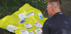 Darryl Ivy on the phone with Oregon OSHA (Occupational Safety and Health) reviewing labels of the chemicals used on his job site while working for Applebee Aviation in Douglas County.